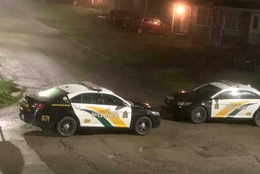 Cape Breton Regional Police cruisers block off the entrance to Hillside Road while responding to a report of "shots fired" in the area after 12 a.m. on Oct. 13. No one was injured and four people were arrested. CONTRIBUTED/VIVIAN FENNELL