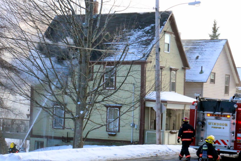 Windsor firefighters quickly attacked the fire that was spreading at this residence on O'Brien Street on Feb. 14, 2016.