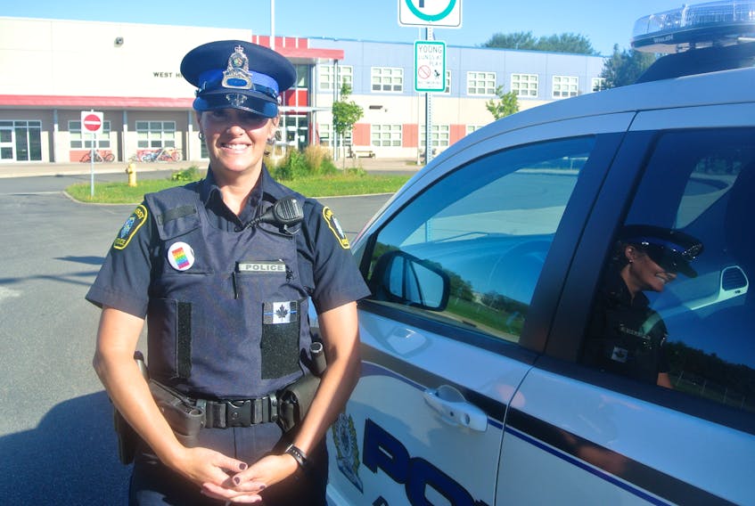 Const. Michelle Harrison stands in front of West Highlands Elementary School. She is the school liaison officer for Amherst’s two elementary schools, E.B. Chandler Junior High and ARHS. She is reminding students and motorists to be safe now that they are back in the classroom.