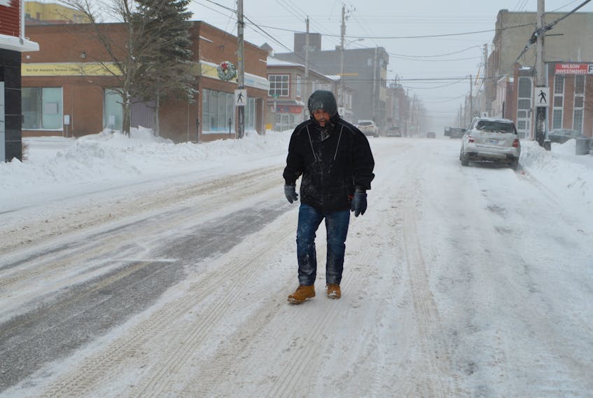 Here we snow again!

Terry Ferguson of Sydney walks down a practically deserted Charlotte Street in Sydney Friday morning, in the midst of the fourth major winter storm to hit the area in the new year. Cape Breton Regional Police was warning motorists to stay off the roads due to 100 km/hr winds that created hazardous driving conditions and impacted visibility. Another 10-25 cm of snow was in the forecast for Friday. Sharon Montgomery-Dupe/Cape Breton Post