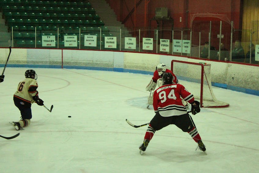 Parkview forward Connor Goodick, far left, is shown about to fire a shot on Glace Bay goaltender Nick Bigley during overtime of his team’s game against the Glace Bay Panthers at the Nova Scotia School Athletic Federation provincial championship at the Canada Games Complex on Friday.  Goodick scored an unassisted goal on the shot to give his team a 3-2 victory in the back and forth contest. Parkview jump out to 1-0 second period lead before Glace Bay would score two third period goals to take a brief lead. Parkview scored with 3:44 to play in the third period to set the stage for Goodick’s heroic goal.