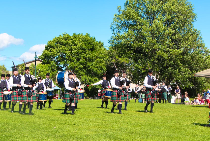 The College of Piping, from Summerside, P.E.I., is evaluated by the judges, on Saturday afternoon at the Antigonish Highland Games. Richard MacKenzie