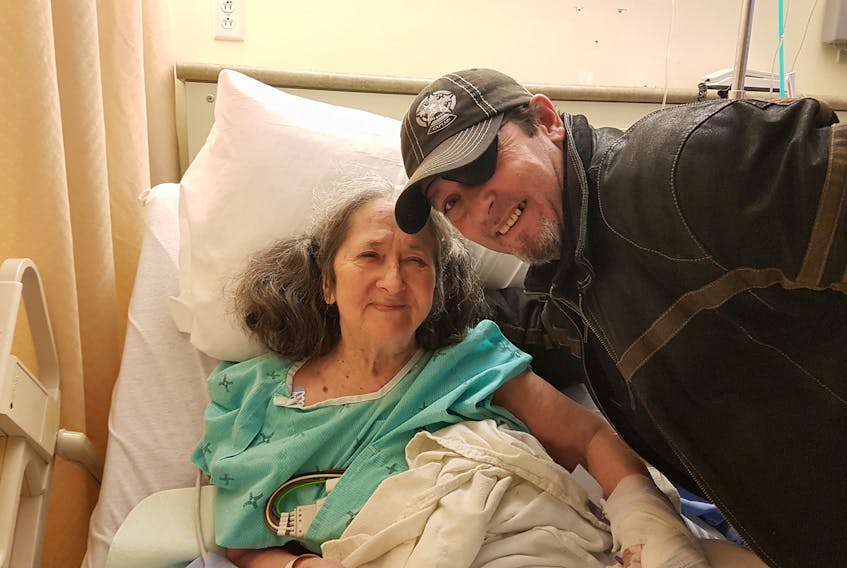 Jeff Hiltz of Springhill has a photo taken with his mother, Doreen, who is a patient in the ICU at the Cumberland Regional Health Care Centre.
