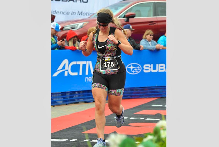 Holly Amirault finishes the recent Ironman 70.3 event in Mont-Tremblant, Quebec.