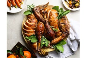 This Middle Eastern inspired za'atar and honey-glazed roasted turkey is the showpiece of a multicultural inspired Thanksgiving table. - Turkey Farmers of Canada