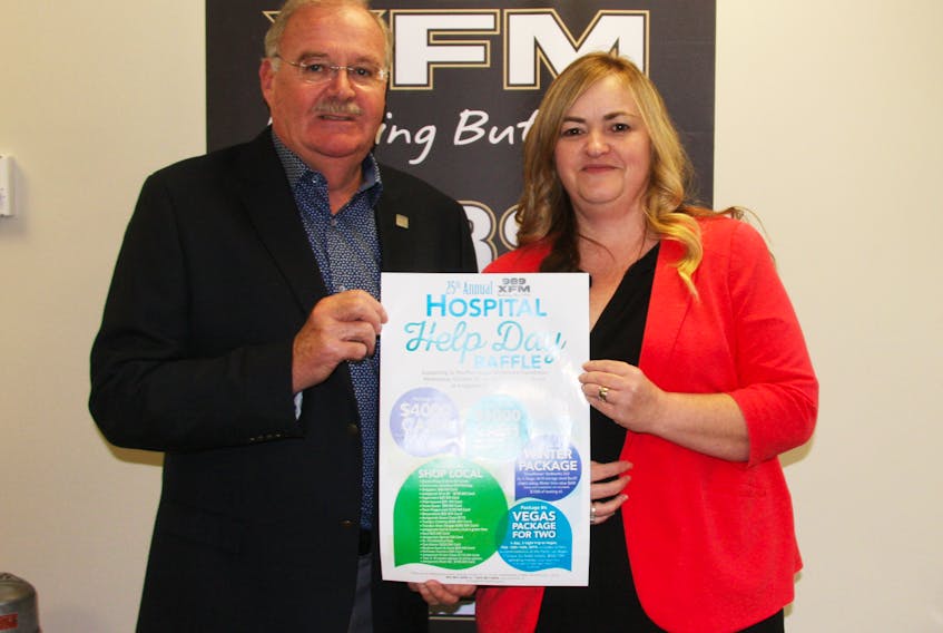 989 XFM general manager Ken Farrell and St. Martha’s Regional Hospital Foundation executive director Sadie Benoit with the promotional poster for this year’s 989 XFM Hospital Help Day Raffle which will take place Oct. 24 at Antigonish Market Square. Richard MacKenzie