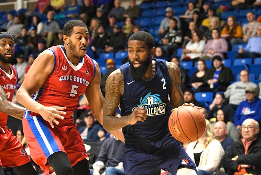 Terry Thomas of the Halifax Hurricanes, right, works his way around Theron Laudermill of the Cape Breton Highlanders during Game 4 of the NBL Canada playoff series Wednesday at Centre 200. Game 5 of the Atlantic Division semifinal is set for Saturday evening in Halifax.