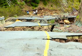 In this file photo from September of 2010, the road to Lower Lance Cove is cratered and torn apart as family and police search for 80-year-old Allan Duffett, who died when he was swept away by floodwaters at the height of the rainfall from Hurricane Igor. — Keith Gosse/The Telegram/File