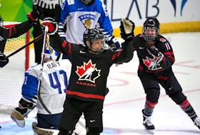 Halifax’s Jill Saulnier, right, celebrates a goal by Canadian teammate Rebecca Johnston in a 6-1 win over Finland at the IIHF women’s world hockey championship on Tuesday.