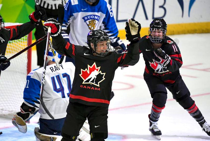 Halifax’s Jill Saulnier, right, celebrates a goal by Canadian teammate Rebecca Johnston in a 6-1 win over Finland at the IIHF women’s world hockey championship on Tuesday.
