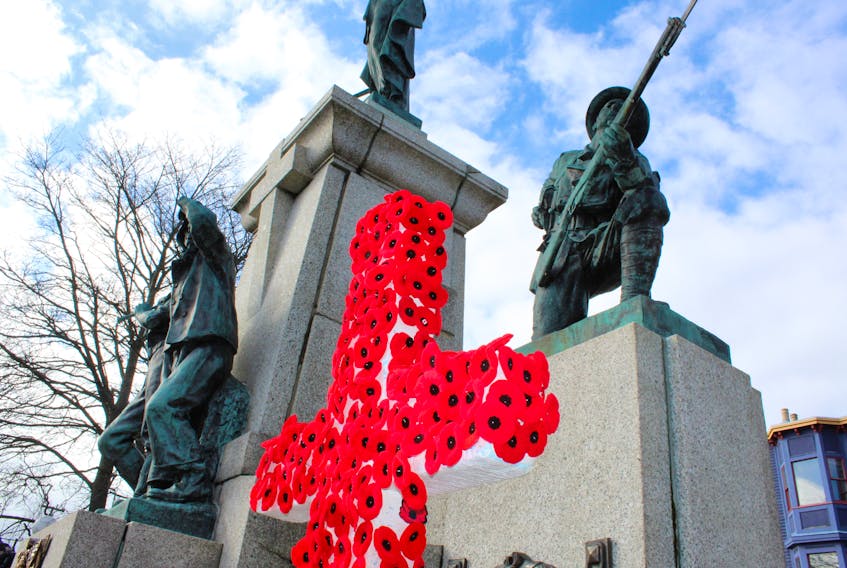 People gathered at the National War Memorial in St. John's left their poppies pinned to two crosses at the end of the Remembrance Day ceremony.