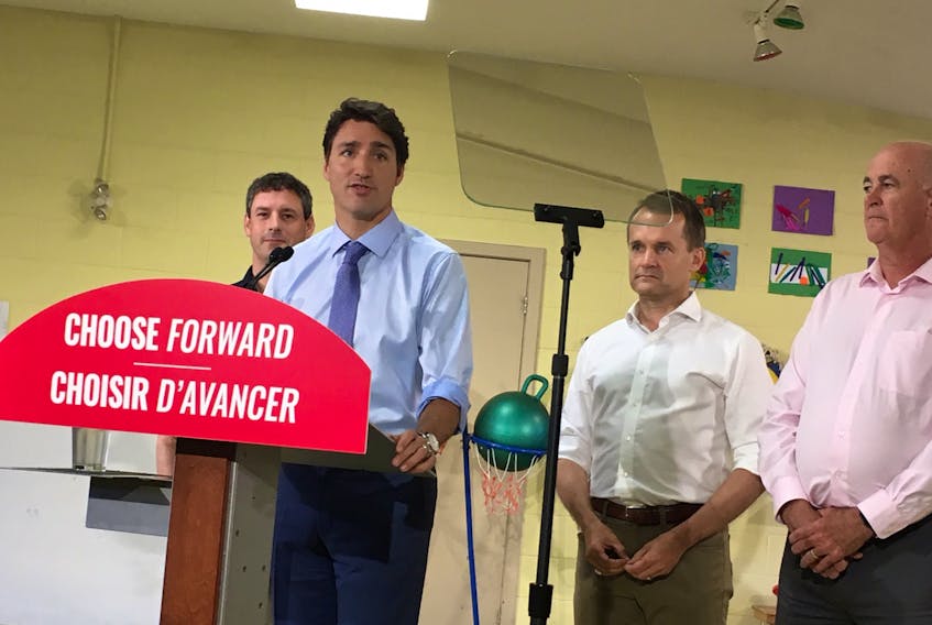 Liberal Party Leader Justin Trudeau (second from left) speaks during a campaign stop in St. John's Tuesday morning. Also shown (from left) are Liberal incumbents  Nick Whelan (St. John's East) Seamus O'Regan (St. John's South-Mount Pearl) and Ken McDonald (Avalon).