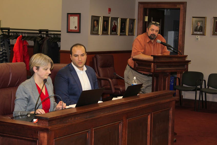 Dunsky consultants Julie-Ann Vincent, left, and Ahmed Hanafy with Greg Gaudet, director of municipal services, present information about Summerside's electrical options at council Feb. 27.