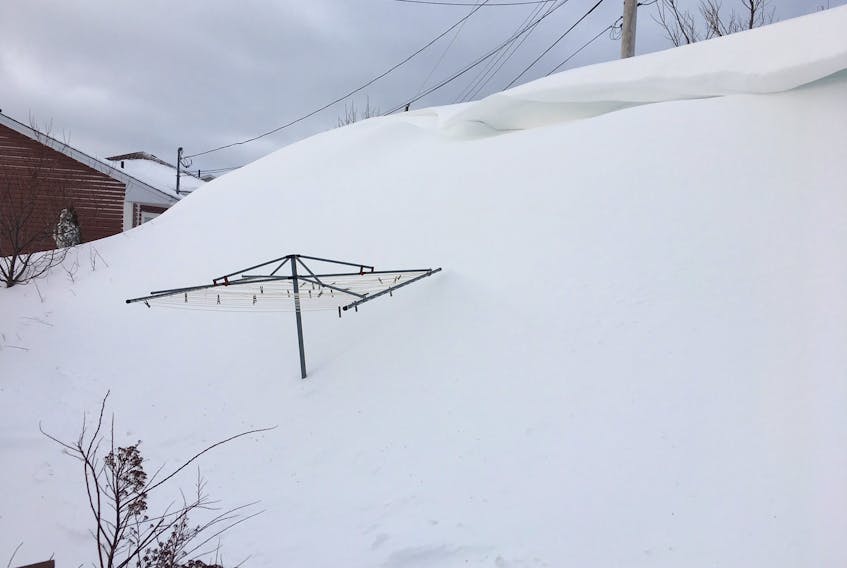 Many residential properties are facing high amounts of snow today, as is this backyard in Paradise. The Telegram