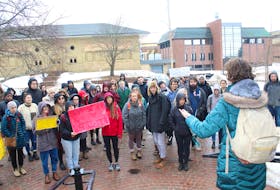 Mount Allison student Julia Connolly, right, speaks to the crowd of university and high school students who took part in a walkout Wednesday afternoon, part of a nation-wide movement to show solidarity for the Wet’suwet’en Hereditary Chiefs and their opposition to the Coastal GasLink pipeline project.