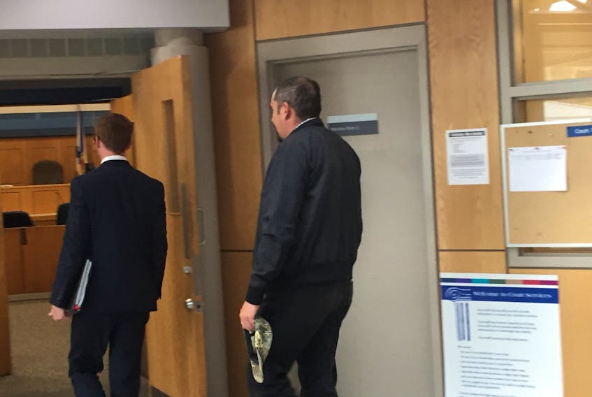 Shawn Wade Hynes follows his lawyer into the court room. Hynes is charged with criminal negligence causing bodily harm and assault with a weapon. He has pled not guilty.