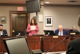 Summerside City Councillor Carrie Adams presents the bylaw and policy review committee report to councillors at a regular monthly council meeting in January