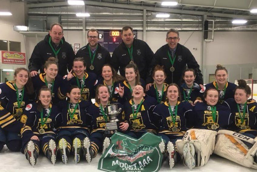 The Mid-Isle Wildcats pose for a team photo after winning the P.E.I. Midget AAA Female Hockey League championship on Friday night. The Wildcats edged the Kings County Kings 1-0 to win the best-of-five final series 3-1. Members of the Wildcats are, front row, from left: Maggie Linkletter, Keiran Andrews, Makayla Larsen, Kennedy Francis, Jacqueline Mix, Hannah LeClair and Lexi Murphy. Middle row: Charlotte Linkletter, Carla Stewart, Madeline Hamill, Sophie Flynn, Tait Tierney, Cassie Doiron, Lisa Stevenson and Jennifer Stewart. Back row: Shane Hamill, Andrew MacEwen, Blair Stewart and Kevin Andrews. Missing from photo are Kelsey Weeks, Maureen Mix and Ellen Chapman.