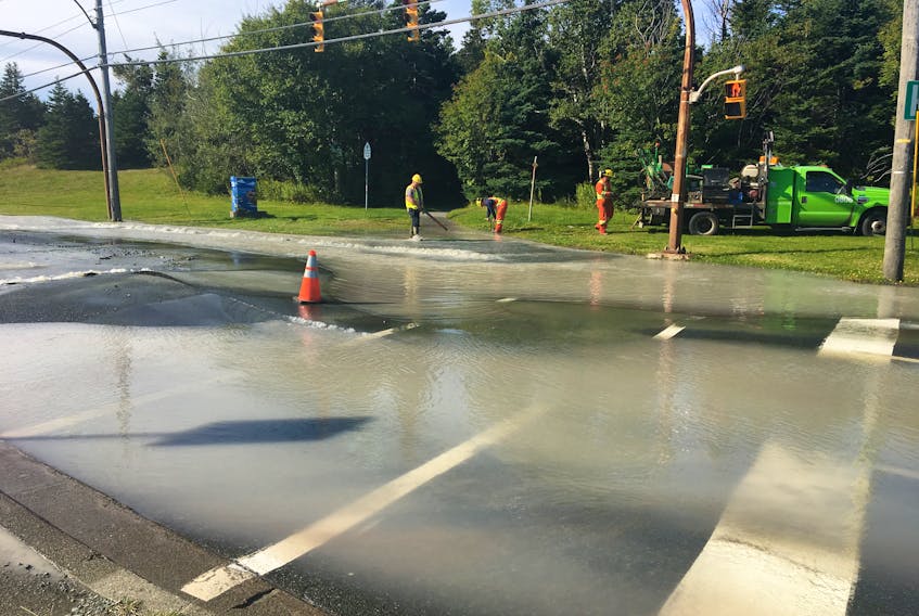 A City of St. John's public works crew assesses a major water main break on Allandale Road in St. John's Friday morning. The road has been closed to traffic.
