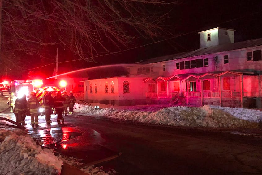 Firefighters are shown putting out hotspots after a fire at the former St. Agnes convent in New Waterford early Saturday morning. The cause of the fire was unknown as of early Saturday morning.