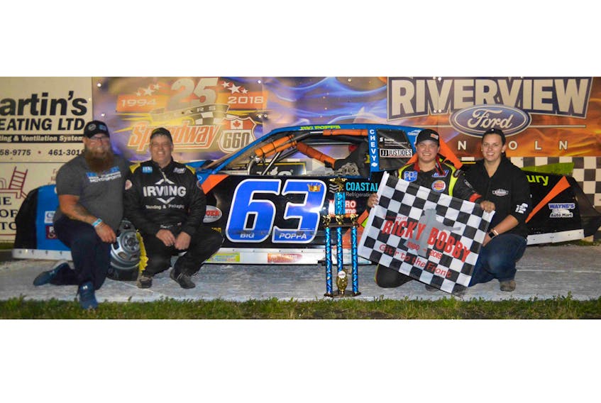 The Taylor Built Rentals Brain Injury Awareness car recently won the Ricky Bobby 150 memorial race in Geary, NB. From left are car co-owner Tom Nicholls, Dave O’Blennis, driver Courtney O’Blennis and Alexandra O’Blennis. Ken MacIsaac Racing photo/Special to The Guardian