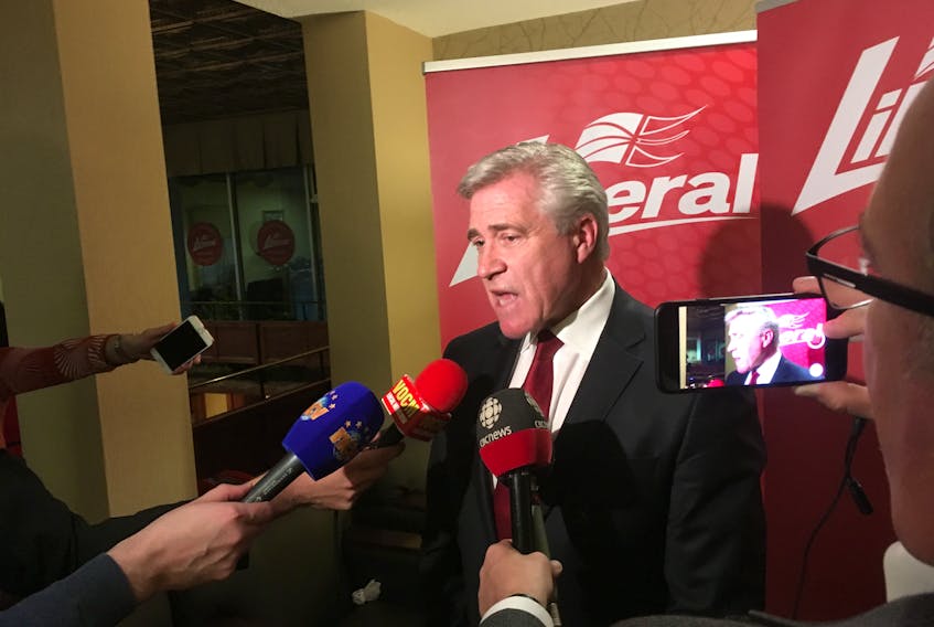 Premier Dwight Ball speaks with reporters late Saturday night, at the Liberal general meeting and convention in Gander.
