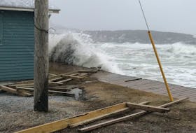 Waves crashed into the boardwalk along the waterfront in Trout River. CONTRIBUTED