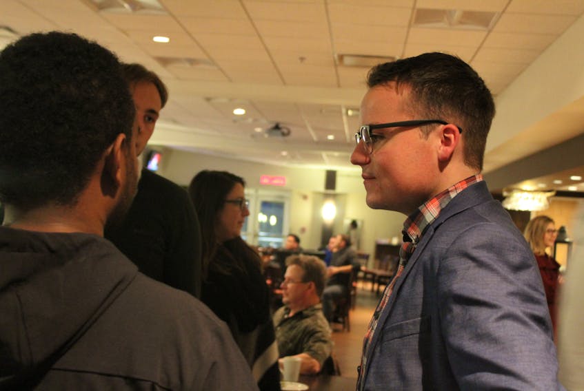 Conservative Egmont Candidate Logan McLellan chats with a supporter during Tuesday night’s election results party in Summerside. McLellan finished second behind Liberal incumbent Bobby Morrissey.