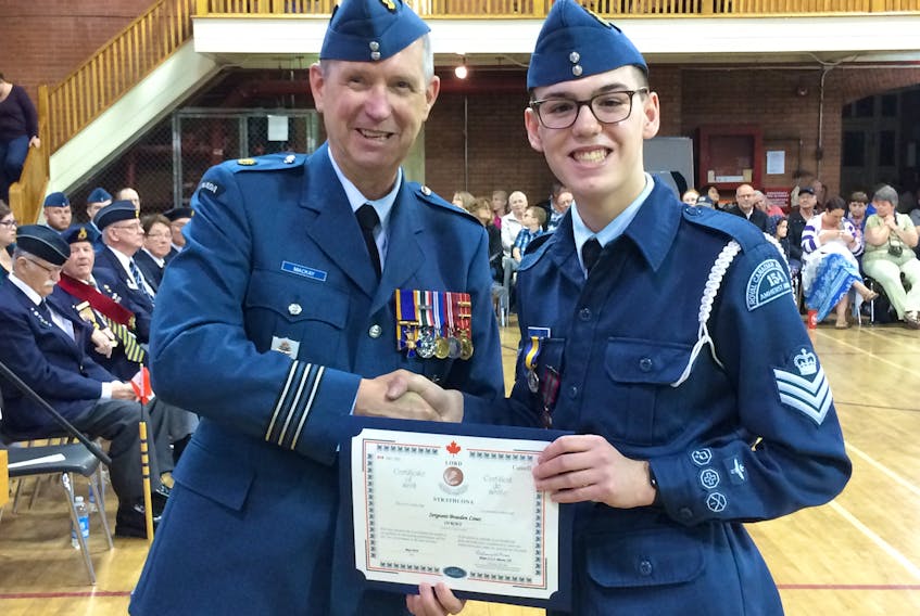Lt. Col. R.W. (Bob) MacKay (left) presents the Lord Strathcona Medal and Certificate to Flight Sgt. Braeden Lines during the 154 Amherst Anson Royal Canadian Air Cadet Squadron’s 77th annual review on May 26 at the Col. James Layton Ralston Armoury in Amherst.