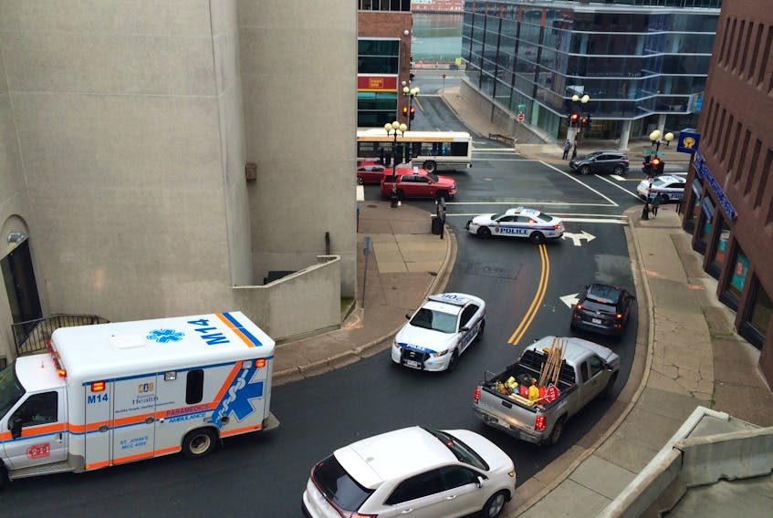 Emergency crews responded to reports of an individual standing on the roof of the BMO building in downtown St. John's and threatening to harm himself on Friday morning.
