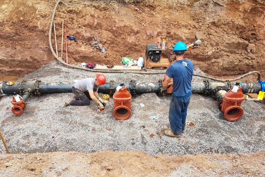 Construction took place Friday on town water pipes that are being connected to its new water treatment plant.