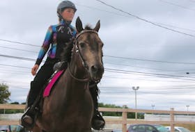 Alison White rode Lace (Simply Bar) in the 4-H junior western pleasure class at the NSPE grounds during the exhibition's 4-H day. Alison, 12, is a member of the Truro-North River 4-H Club.