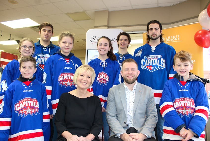 Sarah Millar, centre left, general manager of Consolidated Credit Union in Summerside and Geoffrey Kowalski, executive director of Hockey P.E.I., with members of the hockey community in Summerside. Thanks to a new sponsorship agreement made by P.E.I. Credit Unions, all minor hockey kids on the Island in 2020 will have free access to the World Under-17 Hockey Challenge when it comes to Summerside next year.
