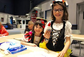 It was Kid’s Night Out, Parent’s Night Off at the Johnson Geo Centre Friday night as children ages five to 12 years old enjoyed a Halloween-themed evening of crafts, a haunted house and a scavenger hunt. Sisters Kylah Ward, 6, and Adeline Ward, 7, are pictured making a ghost craft using cotton balls and glue in the Geo Centre’s solar system room. They dressed up for the occasion as a pirate and a butterfly. In another part of the building, it was also opening night for the scarier version of a haunted house for adults and teenagers age 13 or older. Hall of Horror: A Haunted House Experience is on from 7 to 10 p.m. until Oct. 30, and from 8 to 11 p.m. on Oct. 31.