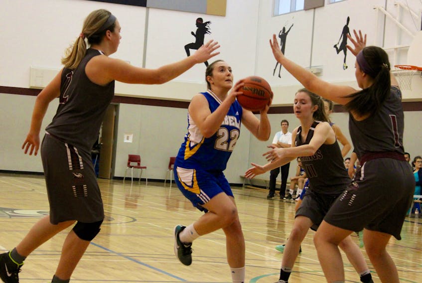 An image from the Steve Brewer memorial basketball tournament for high school girls held Dec. 8-9 in Yarmouth. The Brewer tournament for boys was to have taken place Jan. 5-6 at YCMHS, but it was called off due to storm-related school closures. ERIC BOURQUE PHOTO
