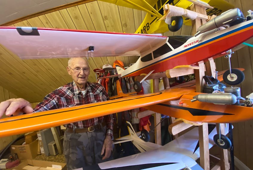 96-year-old Yarmouth County resident Roland Bourque, also a Second World War veteran, stands with some of his model airplanes in his home. He's been fascinated by planes since he was a kid, starting making model planes before he was a teenager and still builds them now. TINA COMEAU PHOTO