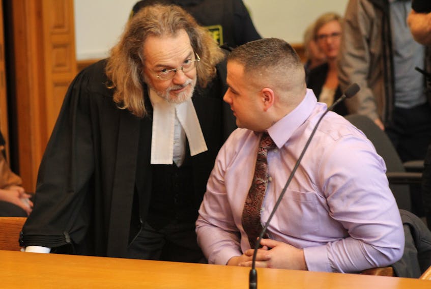 Accused murderer Steven Neville (right) speaks to his lawyer, Bob Buckingham, as jury selection for his trial begins in Newfoundland and Labrador Supreme Court in St. John's Monday.