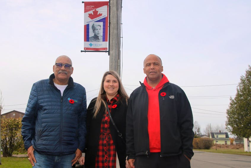 Several new Hometown Heroes banners are hanging in Truro this year. Standing with the one honouring Lloyd Talbot are, from left, Wayne Talbot, Lloyd’s son and Truro town councillor for Ward 1; Megan Burgess, special events and culture coordinator for Truro; and Nolan Borden, who spearheaded the special project to place banners in Truro’s African Nova Scotian communities.