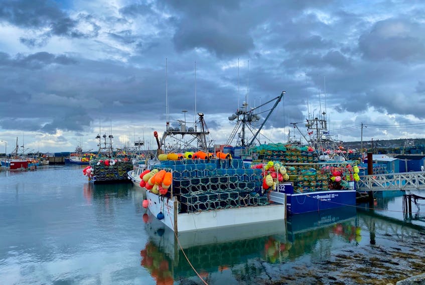 Boats sat at the wharf in the harbour in Meteghan on Dec. 2, awaiting the postponed Dec. 3 start of the LFA 34 fishery. However, on Thursday morning, Dec. 3, with just over an hour to go before the opening of the season, the start got delayed again due to the wind. TINA COMEAU PHOTO