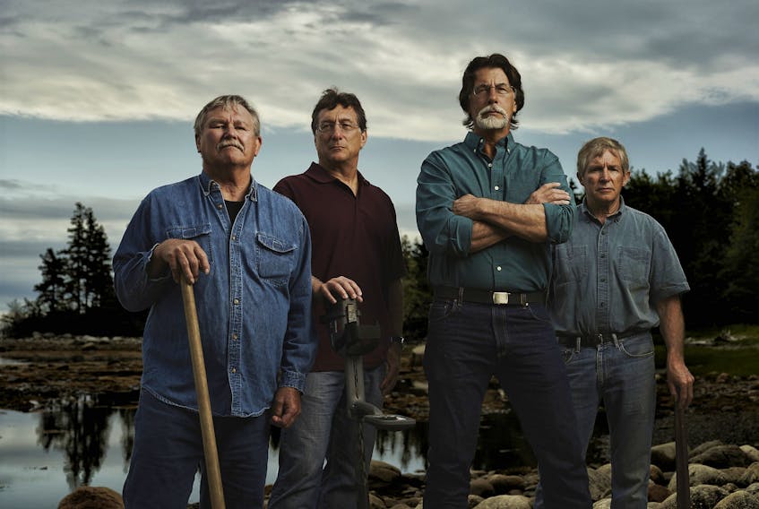 From left, David Blankenship, Marty Lagina, Rick Lagina, and Craig Tester star in The Curse of Oak Island. The new 13-episode season begins Sunday at 11 p.m. on History.  - History Channel
