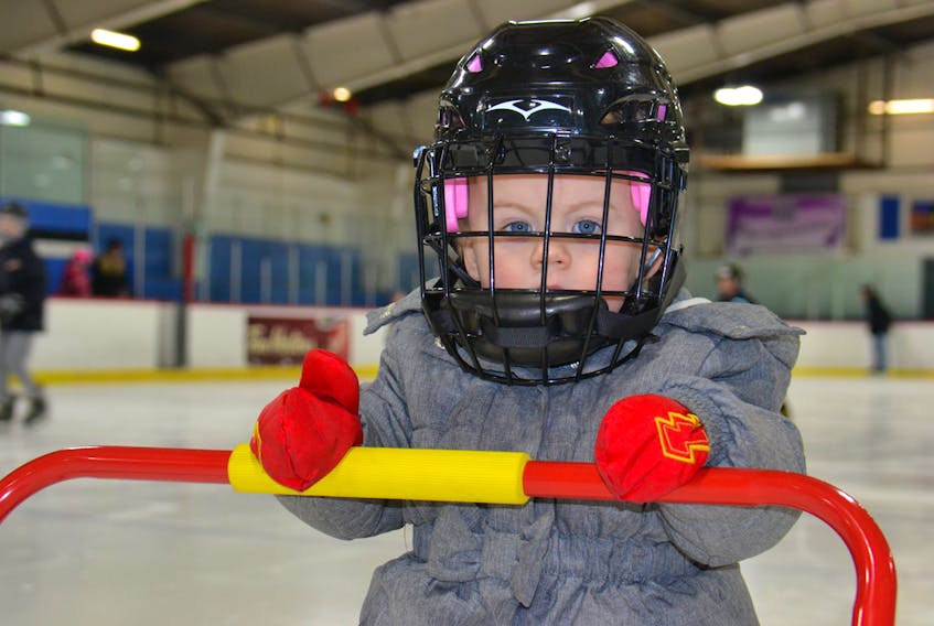 One-year-old Marina Stewart of Charlottetown learns to keep her balance on the ice at Simmon’s Sports Centre Monday during the Islander Day free family skate. KATIE SMITH/THE GUARDIAN