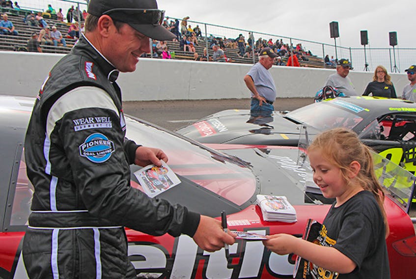 Brooklyn Green wears a wide smile after receiving an autograph from Antigonish native Donald Chisholm of Nova Racing Saturday afternoon (July 14) prior to the IWK 250 at Riverside International Speedway. Corey LeBlanc