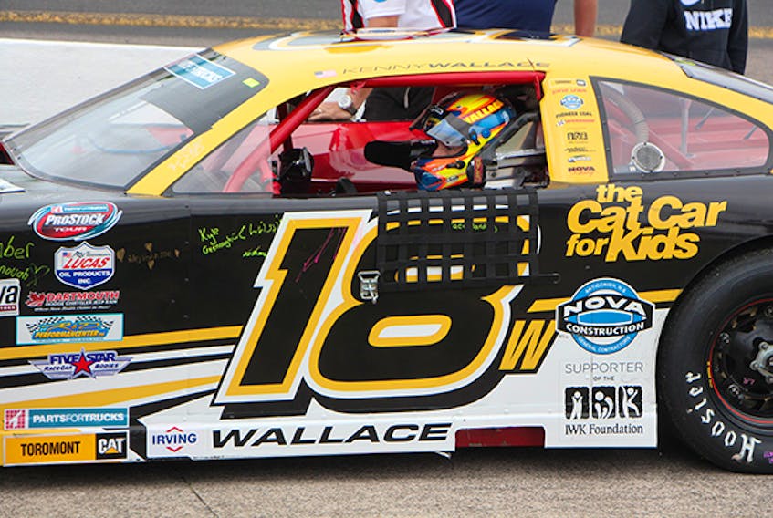 NASCAR legend Kenny Wallace was behind the wheel of the IWK Cat Car for Kids #18 for the IWK 250 at Riverside International Speedway. Corey LeBlanc
