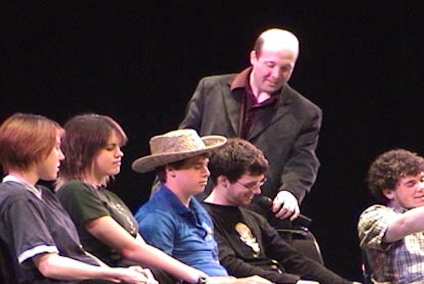 Hypnotist Ian Stewart, interacting with volunteers under the influence of his hypnosis routine.