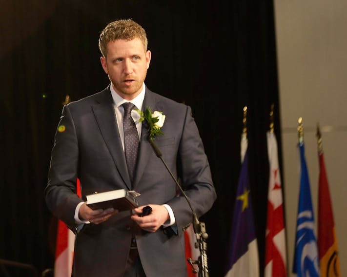 Premier Iain Rankin recites his oath of office Tuesday, Feb. 23, at the Halifax Convention Centre. Communications Nova Scotia