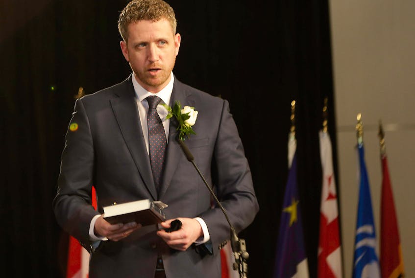 Premier Iain Rankin recites his oath of office Tuesday, Feb. 23, at the Halifax Convention Centre. Communications Nova Scotia