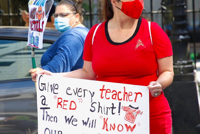 A protester wears a Star Trek red shirt -- representing an expendable character -- while taking part in a rally held by teachers and parents concerned about the safety of the Nova Scotia government's back-to-school plans outside provincial government offices on Granville Street in Halifax on Monday, August 10, 2020.