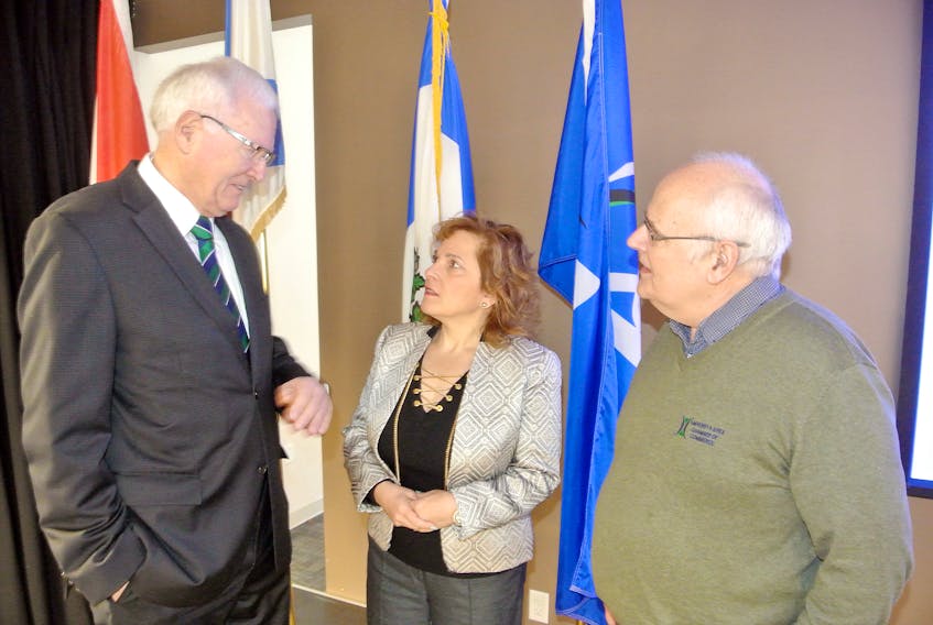 Cumberland-Colchester MP Bill Casey speaks to Nova Scotia Immigration Minister Lena Diab and Amherst and Chamber of Commerce executive director Ron Furlong during a chamber breakfast event on Thursday.