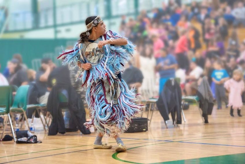 An Indigenous dancer participates in the Connecting Aboriginal Cultures event at UPEI.