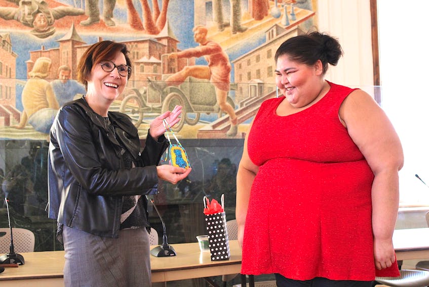 Indigenous children's rights advocate Cindy Blackstock, left, is presented with a special gift from Leona Simon of Elsipogtog First Nation after delivering the keynote address at Mount Allison’s Indigenous Day of Learning and Language last Wednesday.